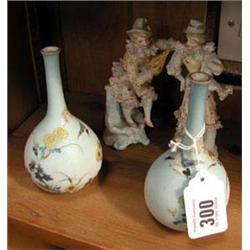 A pair of Oriental bird pattern porcelain vases and a pair of Continental figurines.