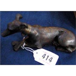 An early cast Iron grey hound with Brass collar.