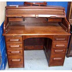 A Mahogany Roll top desk.