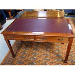 A C1900, Mahogany writing table with red leather inset to top and two drawers under having brass han