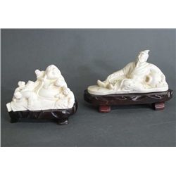 TWO CARVED RESIN FIGURES