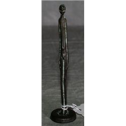Small bronze stick firure of nude woman. H:4" .