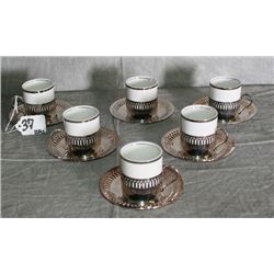 12 piece porcelain and silver plate demitasse set.