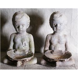 Pair of lead figural garden fountains of boys hol