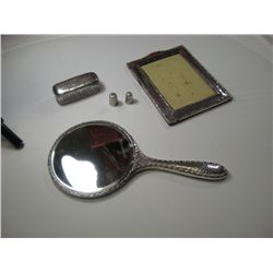 2153 - Sterling lot: mirror, glass jar with sterling top, picture frame, thimblestop, picture frame,