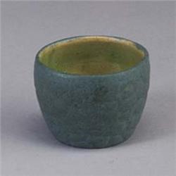 Small GRUEBY vessel covered in a blue-gray frothy glaze. Marked. 2" x 2 1/2" Est.  400 - 600