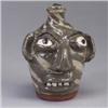 Image 1 : Fine B.B. CRAIG alkaline swirl face jug in two-tone grey, with blue eyes, under a glossy glaze. Stam
