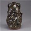 Image 1 : Fine LANIER MEADERS stoneware face jug, ca. 1990, with a misshapen face and seven teeth, and covered