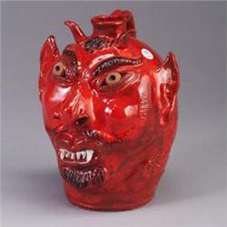 ALBERT HODGE devil's face jug with terra cotta eyes. Hand signed Albert Hodge on reverse 11 times, s