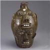 Image 1 : WALTER FLEMING double face jug covered in a green alkaline glaze on front, and brown glaze on back.