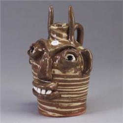 B.B. CRAIG devil's face jug covered in a brown and cream swirled glaze. Stamped B.B. CRAIG/VEIL, N.C