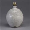 Image 1 : JUGTOWN bulbous lamp base covered in a flowing white semi-matte glaze over a dark body. Circular sta