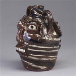 B.B. CRAIG double face jug covered in a brown, white, and indigo swirled glaze. Signed B.B.C. on bot