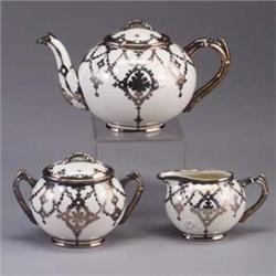 WILLETS BELLEEK three-piece porcelain tea set, all with silver overlay, consisting of a teapot (line
