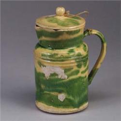 French lidded pot, 19th century, covered in a mottled green and yellow glaze. Some chips and losses
