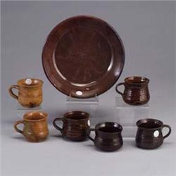 Seven NORTH CAROLINA pieces; six TODDY HALL POTTERY mugs (rim chips to three), and a BEN OWEN pie pl