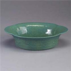 COWAN flaring bowl in speckled turquoise and yellow mottled glaze. Minute nick to base. Two stamped