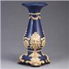 Image 1 : WELLER blue pedestal with ivory floral and face design. Several small chips, lines, and areas of gla