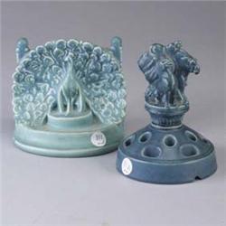 Two ROOKWOOD pieces; a bookend with peacock, 1924, and a flower frog with figural group on pedestal,