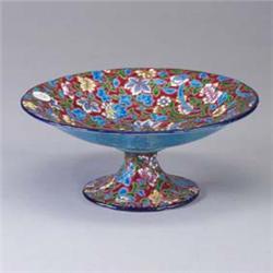 LONGWY footed compote with polychrome flowers and vines on a maroon ground. A couple of nick to base