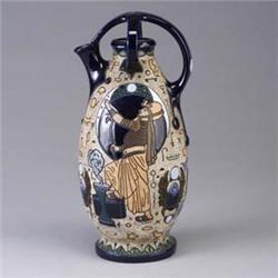 AMPHORA (Czech) pitcher with Egyptian revival motif in polychrome on stippled matte ground. Line thr