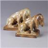 Image 1 : Pair of French figural bookends with hounds covered a butterscotch flambe glaze. One has chips to ba