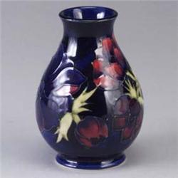 MOORCROFT bulbous vase in the Anemone pattern. Abrasion to rim. Stamped mark. 5 1/2" x 4" Est.  300