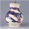 Image 1 : MOORCROFT Dragon lampbase with wrap-around squeezebag dragon figure in shaded of blue on an ivory gr
