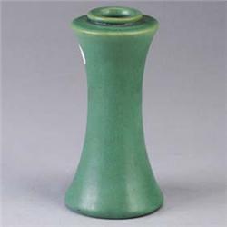 TECO corseted vase covered in a smooth matte green glaze with charcoaling. Stamped Teco. 7" Est.  50