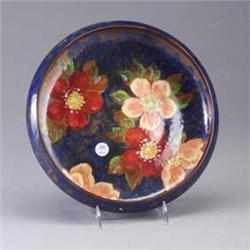 ROYAL DOULTON centerbowl handpainted with wild roses in orange and yellow on a mottled blue ground.