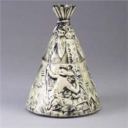McCOY teepee-shaped cookie jar with embossed with a figure and symbolic motifs under a brushed gray