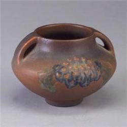 ROOKWOOD squat modeled matte vessel by C.S. Todd, 1913, with green and blue flower on a brick ground