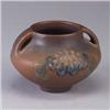 Image 1 : ROOKWOOD squat modeled matte vessel by C.S. Todd, 1913, with green and blue flower on a brick ground