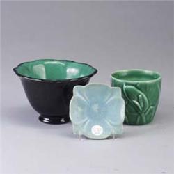 Three ROOKWOOD Production pieces: a small flower-shaped dish, 1914, a small vessel embossed with cal