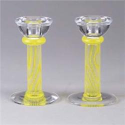 Pair of KOSTA BODA candlesticks with yellow caning to stem. Etched mark. 6" each. Est.  200 - 300