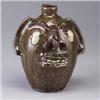 Image 1 : STEVE ABEE, Lenoir, N.C., bearded face jug with oozing white eyes and pointed nose. Incised mark. 9"