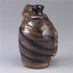B.B.CRAIG jug with snake wrapped around swirled clay base. Stamped mark. 8 1/4" Est.  400 - 600