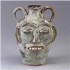 Image 1 : WPF two-handled face jug covered in a sheer mottled ivory glaze. Etched mark. 10" Est.  450 - 650