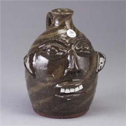 WALTER FLEMING face jug in tan and brown swirled clays. Impressed stamp mark. 8 1/4" Est.  400 - 600