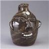 Image 1 : WALTER FLEMING face jug in tan and brown swirled clays. Impressed stamp mark. 8 1/4" Est.  400 - 600