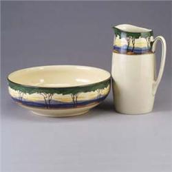 ROYAL DOULTON wash basin and pitcher set, both painted with a mountainous landscape. Hairline to bas