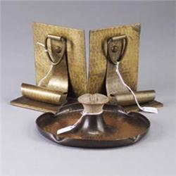 Three ROYCROFT brass-washed hammered copper pieces: a pair of bookends with scroll and ring handle (