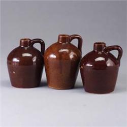Three ROYCROFT jugs, each covered in a crackled brown glaze. Marked. 6" each Est.  100 - 200