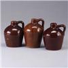 Image 1 : Three ROYCROFT jugs, each covered in a crackled brown glaze. Marked. 6" each Est.  100 - 200