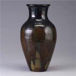 MOUNTAINSIDE POTTERY vase covered in a dripping black over speckled brown glaze. Small chips to base