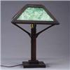 Image 1 : Arts & Crafts table lamp with flaring, four-sided shade inset with green slag glass panels, on a squ