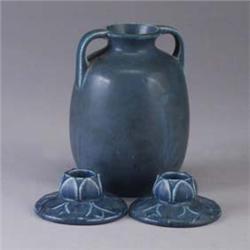 Three blue ROOKWOOD Production pieces; a bulbous vase, 1923, and a pair of low floriform candlestick