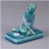 Image 1 : ROOKWOOD paperweight, 1952, with nude figure covered in a glossy teal glaze. Repaired crack through