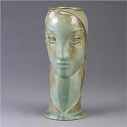 AETCO vase in the form of a woman's bust, covered in a pale green and umber crystalline glaze. 2" li