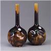 Image 1 : Pair of RORSTRAND bottle-shaped vases each covered in a mottled deep purple to umber glaze. Stamped